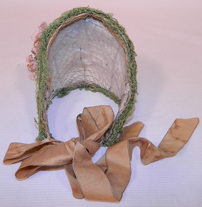 Victorian Civil War Beaded Woven White Straw Green Lace Pink Flower Trim Spoon Bonnet
It is in good condition, with only some water spot stains and frayed splits on the silk ribbon ties. This is truly a rare early find and wonderful piece of wearable Victoriana millinery art! 