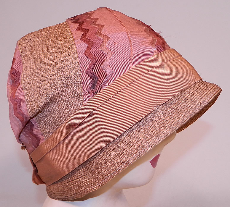 Vintage Art Deco Tango Pink Silk Ribbon & Woven Straw  Flapper Cloche Hat 
It is made of a dusty rose, tango pink color tightly woven straw, with matching silk damask ribbon trim with a Art Deco chevron brocade design. 