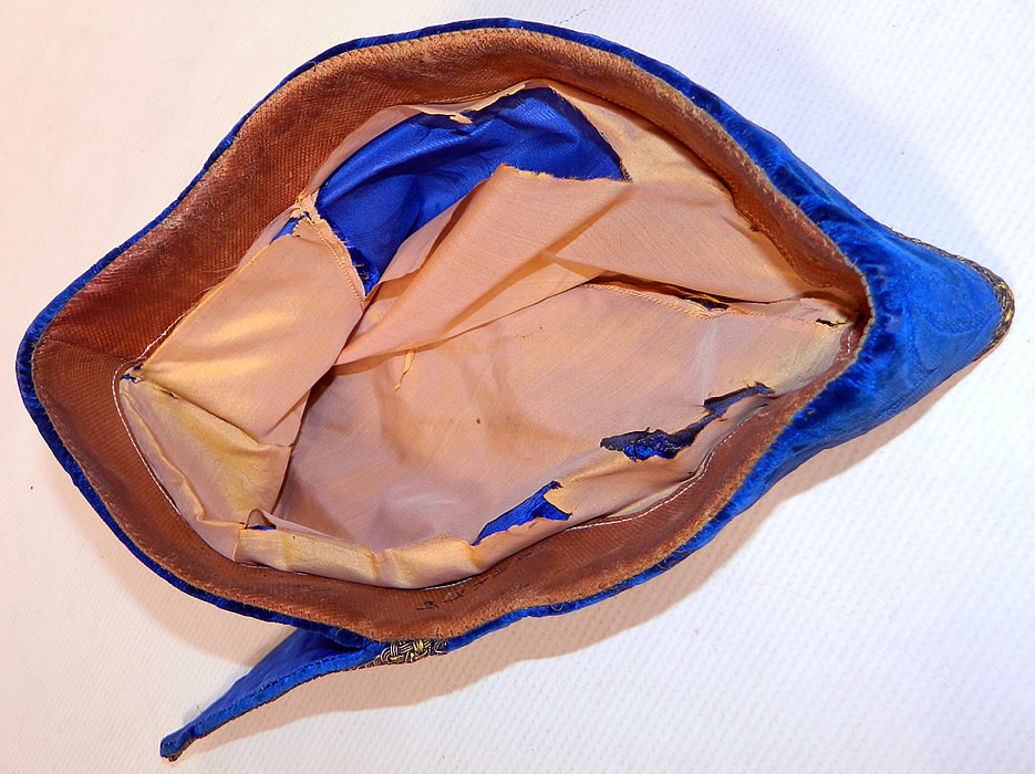 Vintage Hungary Regional Folk Costume Blue Burnout Voided Velvet Gold Trim Cap Archers Hat
The blue bonnet measures 22 inches inside circumference. 
It is in good condition, with only some fraying on the inside silk lining and is a museum deaccession.