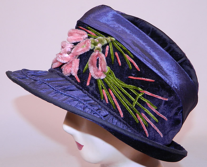 Vintage Periwinkle Silk Velvet Wide Brim Chenille Embroidered Flower Flapper Cloche Hat
It is made of a dark bluish purple periwinkle color silk and velvet fabric, with green and pink chenille embroidered flowers on the front.