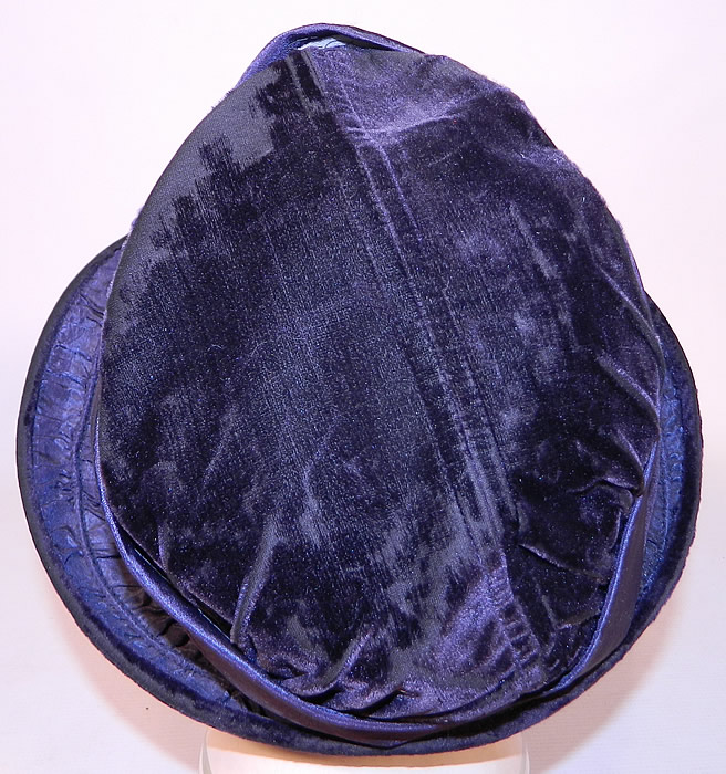 Vintage Periwinkle Silk Velvet Wide Brim Chenille Embroidered Flower Flapper Cloche Hat
The hat measures 23 inches inside crown circumference. It is in good condition, with only some minor wear to the velvet nap. 