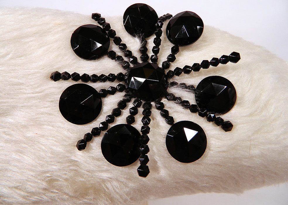 Vintage Leon Hats NY Label Black & White Felt Fur Jet Beaded Trim Tricorn Hat
There is a black jet beaded snowflake trim sewn onto the front upturned brim and a black velvet ribbon hatband. 