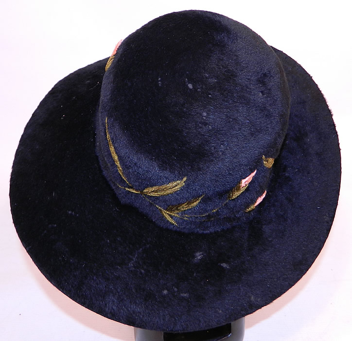 Edwardian Belle Epoque Black Plush Velvet Pink Silk Rosette Embroidered Wide Brim Hat
The hat measures 23 inches inside crown circumference and is 42 inches outside the brim. 