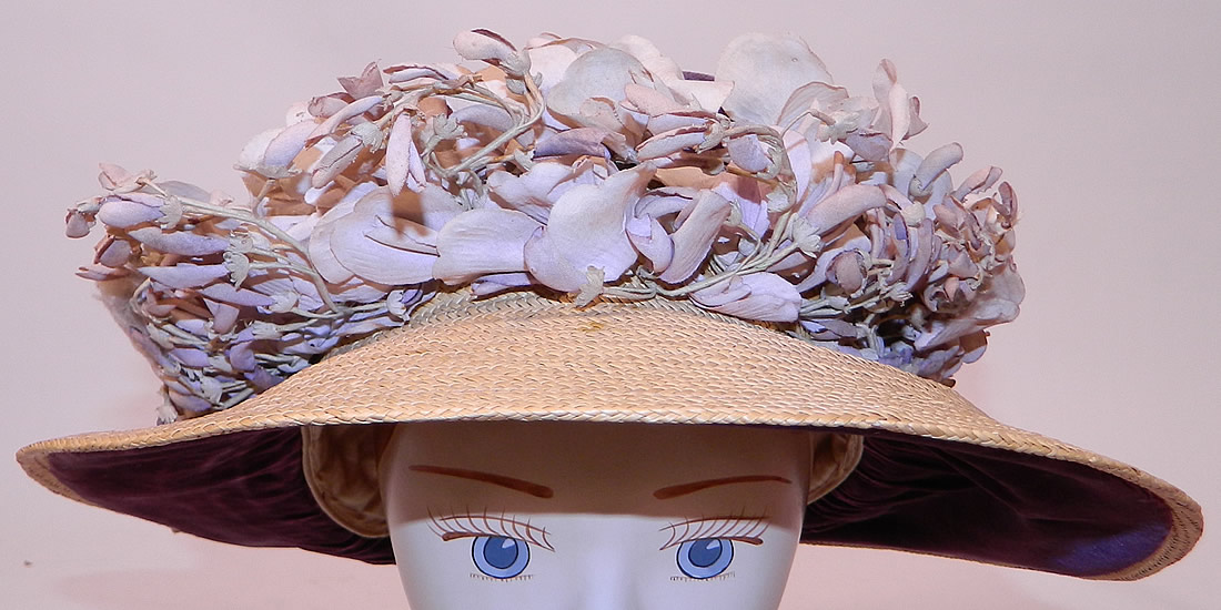 Edwardian Woven Natural Straw Purple Velvet Violet Flower Trim Wide Brim Hat
The hat measures 24 inches inside crown circumference and is 43 inches outside the brim. 