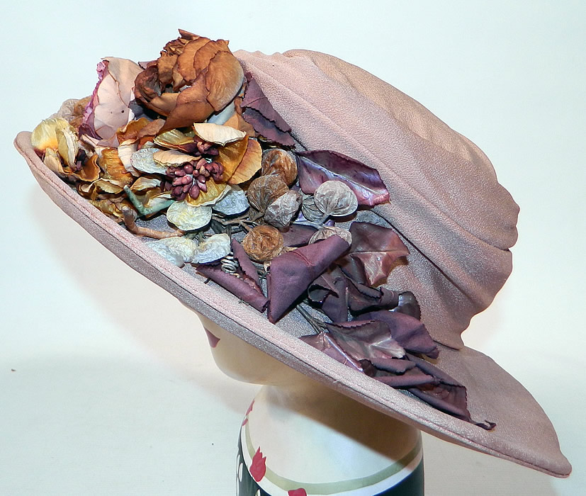 Edwardian Belle Epoque Taupe Silk Autumn Fall Floral Foliage Trim Wide Brim Hat
This Edwardian era Belle Epoque taupe silk autumn fall floral foliage trim wide brim hat dates from 1915.