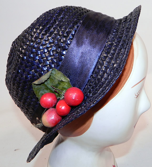 Vintage Navy Blue Woven Straw Red Cherry Silk Ribbon Bow Trim Childs Cloche Hat
This vintage navy blue woven straw red cherry silk ribbon bow trim child's cloche hat dates from the 1920s.