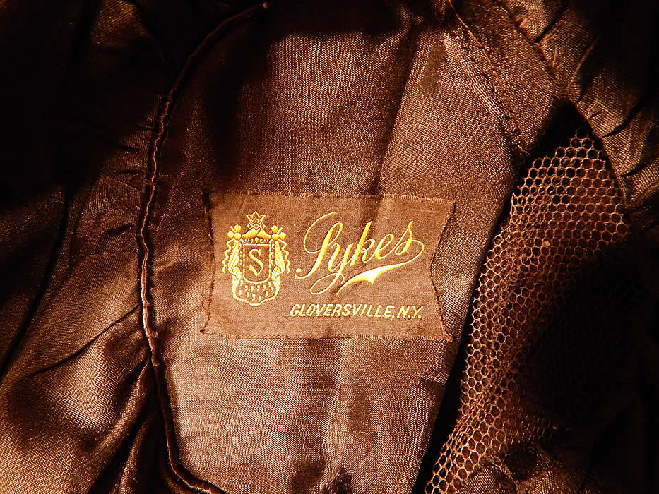 Vintage Sykes NY Label Brown Beaver Felt Fur Gold Jeweled Trim Toque Cloche Hat
It is fully lined in a black silk fabric with a "Sykes Gloversville, N.Y." label inside.
