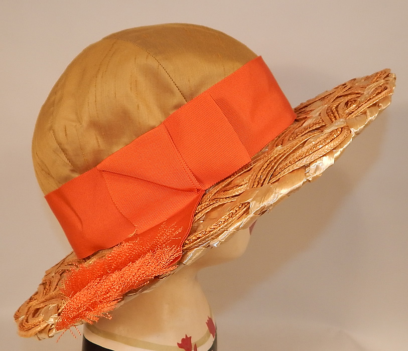Vintage Schiaparelli Paris Yellow Orange Silk Woven Natural Straw Raffia Wide Brim Hat
This vintage Schiaparelli Paris yellow, orange silk woven natural straw raffia wide brim hat dates from the 1960s.