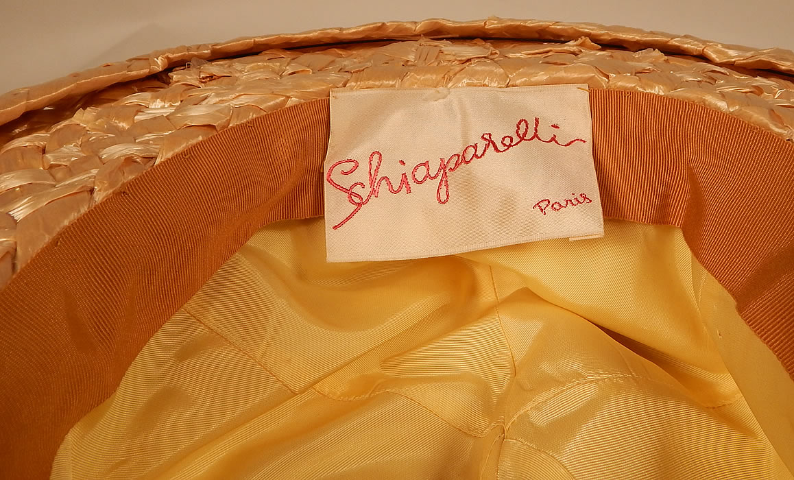 Vintage Schiaparelli Paris Yellow Orange Silk Woven Natural Straw Raffia Wide Brim Hat
This sensational summer sun hat has a boater style with wide brim and fully lined soft fabric crown. There is a "Schiaparelli Paris" designer label sewn inside.