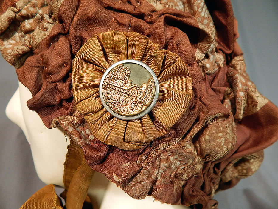 Victorian Brown Silk Ruched Ribbon Steel Cut Button Trim Carriage Bonnet Travel Cap Hat
It is made of a brown silk and floral damask brocade ribbon fabric pieced sewn together with ruched gathering.