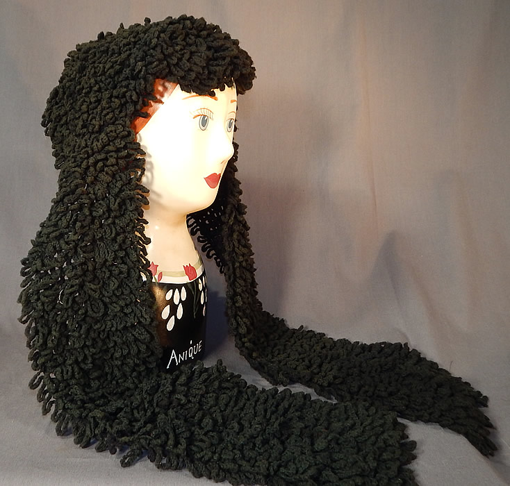 Victorian Black Boucle Looped Wool Hand Knit Winter Bonnet Lappet Scarf
This unique women's winter bonnet hood headdress would have been worn for travel in a sled or carriage and has a head scarf style with long lappet end ties, a triangle shape top covering the head and is unlined.