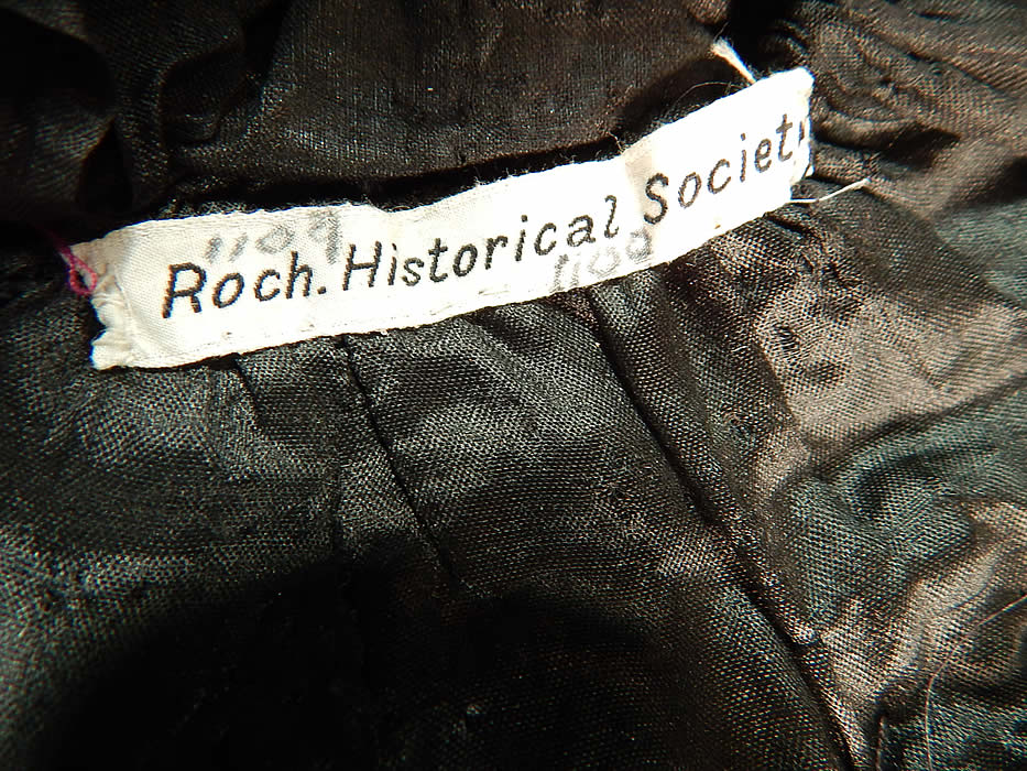 Victorian Woven Black Straw Pink Roses Jet Beaded Buckle Trim Bonnet Hat
This beautiful bonnet has black silk ribbon ties for securing under the chin, is fully lined with a black silk fabric and is a museum deaccession piece from the Rochester Historical Society with label tag sewn inside. 