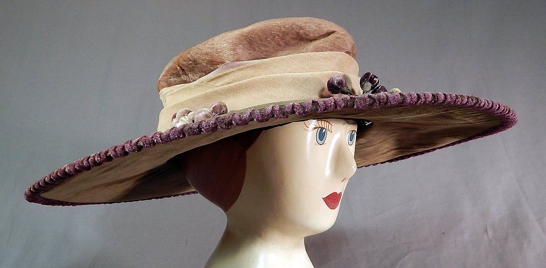 Edwardian Lavender Purple Gray Velvet Grape Berry Leaf Large Wide Brim Hat
The hat measures 17 inches wide across the brim, 52 inches in circumference on the outside and has a 22 inch inside crown circumference. 