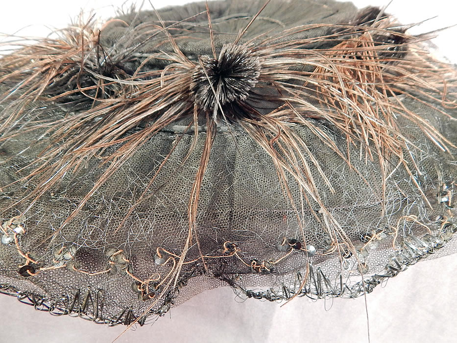 Edwardian Black Tulle Net Sequin Feather Trim Large Wired Wide Brim Hat
It is in good as-is condition, with some fade discoloration on the feathers, some loose feather trim and slight fraying along the brim edging in areas (see close-ups).