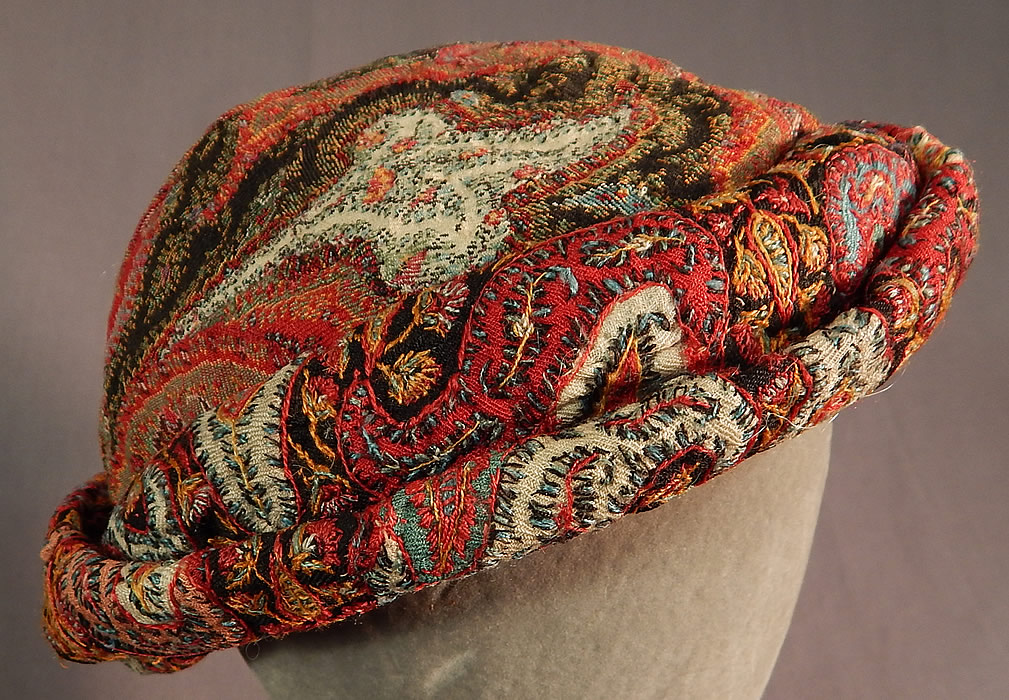 Vintage Lilian Deyber Antique Embroidered Kashmir Wool Paisley Turban Hat
This stunning turban style hat has a rolled brim, is fully lined in a brown rayon nylon fabric and mesh tulle netting underneath that.
