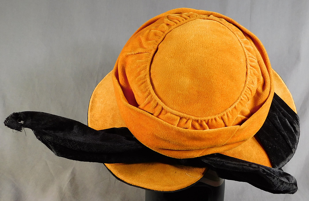 Vintage Harris Hat & Cloak Shop Orange Black Velvet Winged Wide Brim Cloche
It is in good condition, with only some small fraying on the winged end where the wire is poking through (see close-up).