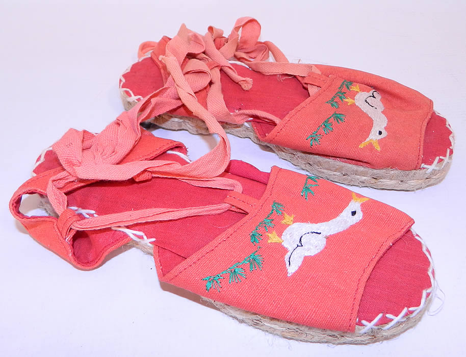 Vintage Red Linen Geese Ankle Tie Rope Sole Childrens Beach Sandal Shoes. These charming children's summertime beach sandal shoes have woven rope bottom soles, with heel caps, a red linen inside lining, white decorative cross stitching and red ribbon lacing ankle tie straps.