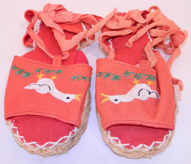 Vintage Red Linen Geese Ankle Tie Rope Sole Childrens Beach Sandal Shoes. This pair of vintage red linen geese ankle tie rope sole children's beach sandal shoes date from the 1940s. 