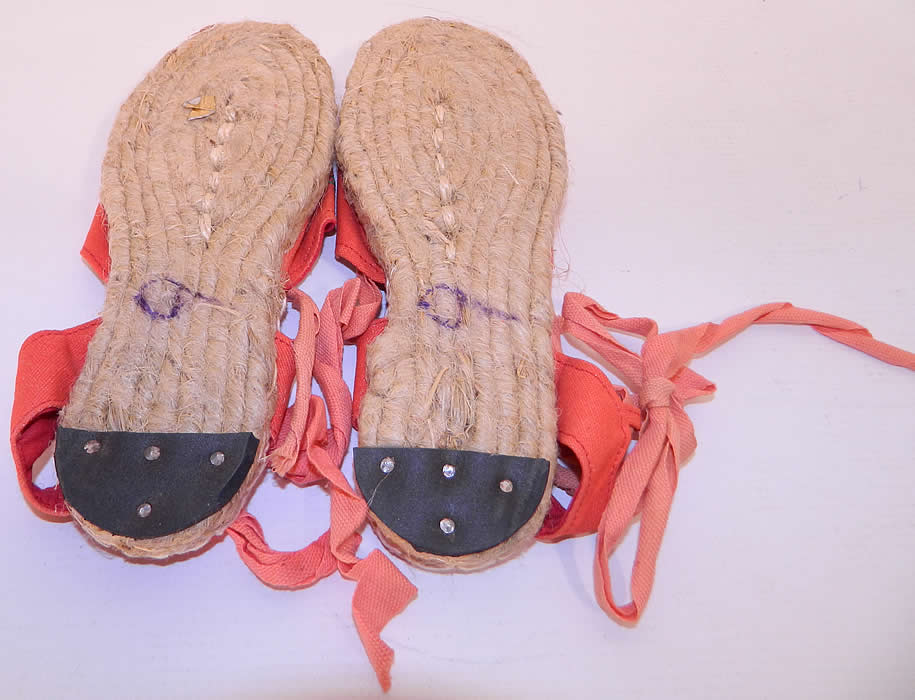 Vintage Red Linen Geese Ankle Tie Rope Sole Childrens Beach Sandal Shoes.The shoes measure 8 1/2 inches long, 3 inches wide and are stamped on the bottom soles a size 9. They have never been worn and are in good unworn condition. 