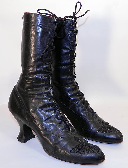 Victorian Antique Black Leather Jet Beaded High Top Lace-up Boots. They are made of black leather, with jet beaded trim on the front toes. The boots have black shoe laces, pointed toes and Louis XV french spool heels.