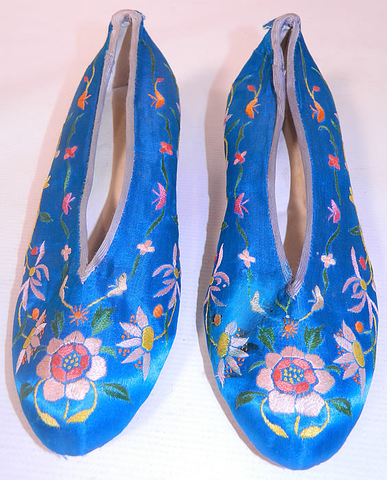 Antique Chinese Royal Blue Silk Embroidered Floral Slipper Shoes. The shoes measure 10 1/2 inches long, 3 inches wide, with 2 inch high heels.
