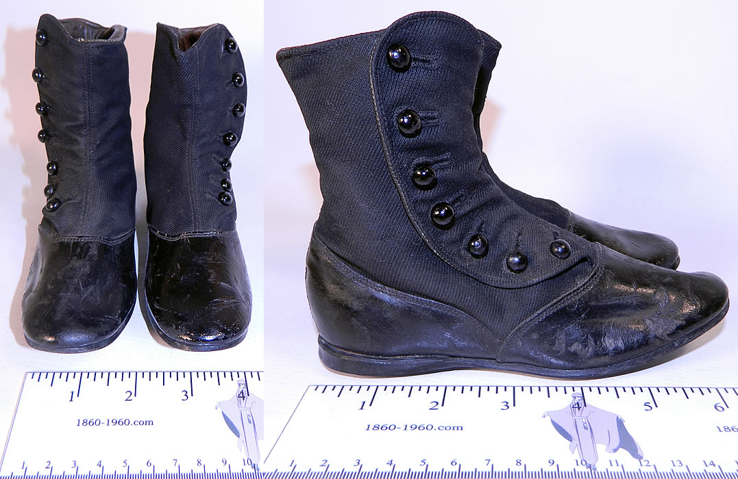 Victorian Black Wool Leather High Button Button Baby Boots Childs Shoes. There are rounded toes, a low heel and hard leather black soles with a slight heel lift. The boots measure 5 inches tall, 7 inches long and are 2 inches wide.