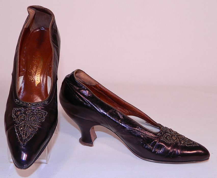 Vintage G. Fox & Co. Edwardian Titanic Era Iridescent Aubergine Bronze Beaded Shoes. This pair of vintage G. Fox & Co. Edwardian Titanic era iridescent aubergine bronze beaded shoes date from 1912. They are made of an iridescent dark purplish brown aubergine eggplant color leather, with steel cut bronze beading done in a decorative pattern design on the front toes vamps and instep.