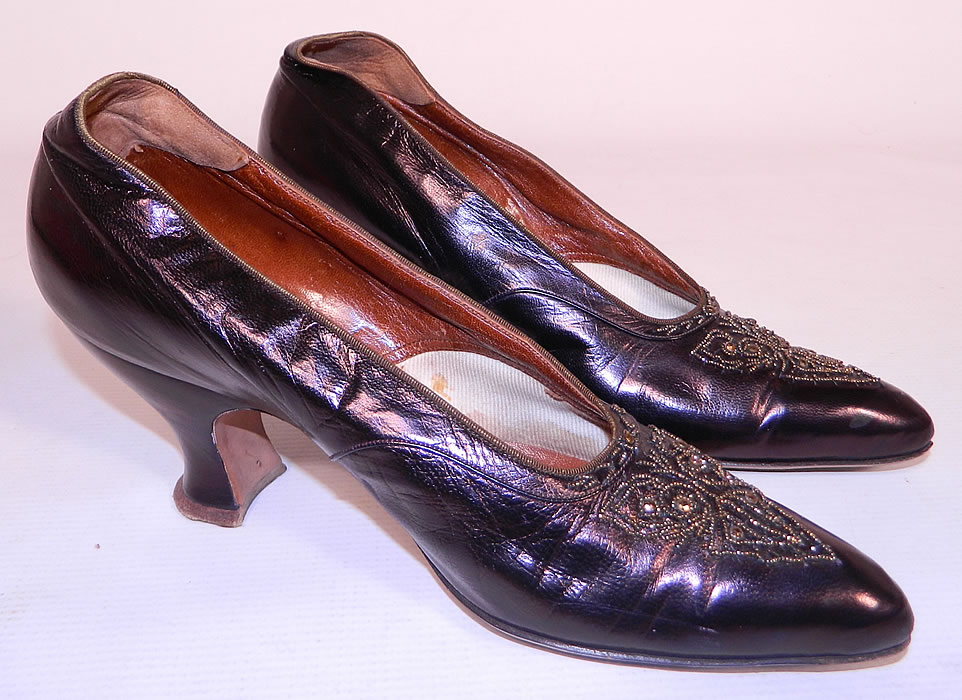 Vintage G. Fox & Co. Edwardian Titanic Era Iridescent Aubergine Bronze Beaded Shoes. These elegant evening shoes have a slip on slipper style, with pointed toes and French Louis XV spool heels.