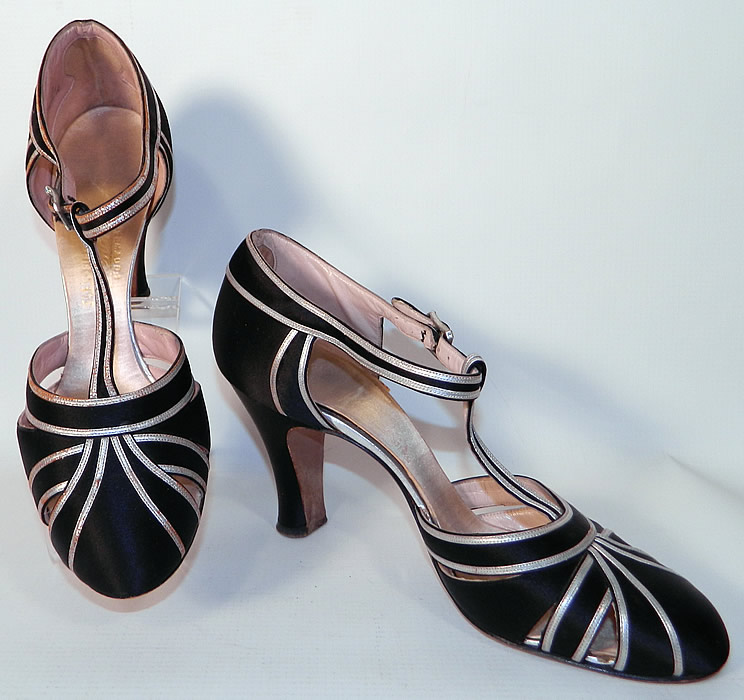 Vintage Saks Fifth Avenue Art Deco Silver Lamé Black Satin T-Strap Shoes. This pair of vintage Saks Fifth Avenue Art Deco silver lamé black satin T-strap shoes date from the 1930s.