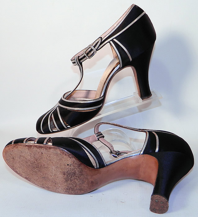 Vintage Saks Fifth Avenue Art Deco Silver Lam&eacute; Black Satin T-Strap Shoes. These elegant evening dance shoes have decorative woven overlapping crisscrossing straps with peek-a-boo openings, a T-strap adjustable ankle strap with rhinestone buckle side closure and black satin fabric covered modified boulevard high heels. 