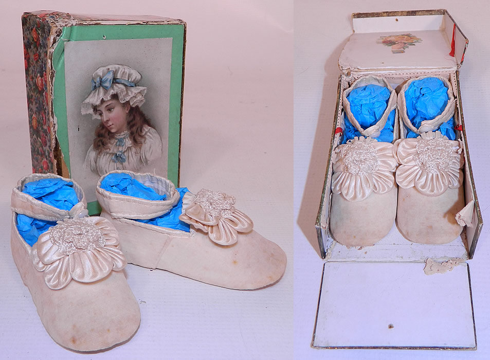 Victorian Antique White Velvet Rosette Maryjane Baby  Infant Shoes & Box. This pair of antique Victorian era white velvet rosette maryjane baby infant shoes and box date from 1900. They are made of an off white ivory color velvet fabric with silk rosette floral petal trim on the instep front vamps.