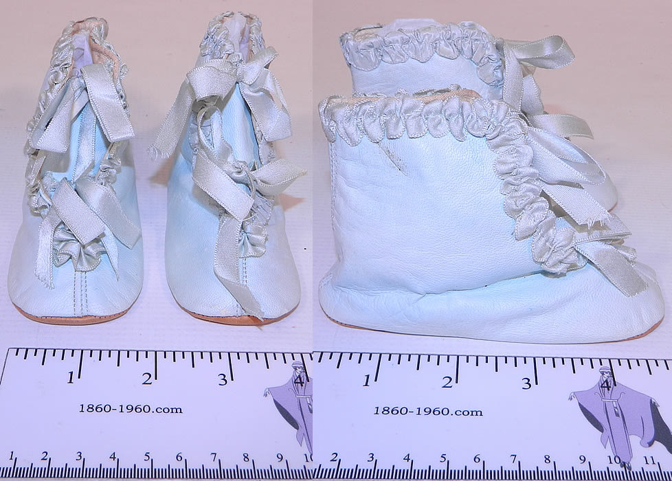 Unworn Victorian Antique Blue Kid Leather Silk Ribbon Baby Boots Infant Shoes. This pair of unworn antique Victorian era blue kid leather silk ribbon baby boots infant shoes date from 1900. They are made of a light baby blue soft kid leather, with pastel blue silk ribbon ruched gathered trim edging.