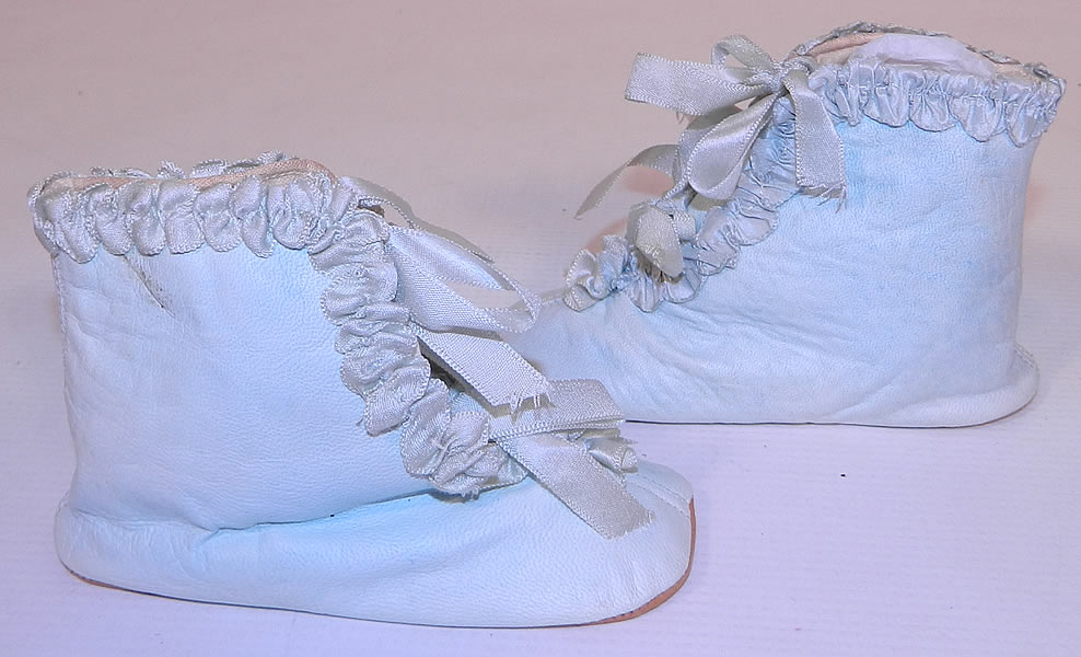 Unworn Victorian Antique Blue Kid Leather Silk Ribbon Baby Boots Infant Shoes. These beautiful baby blue boots have silk ribbon ties for closure on the front, rounded toes and soft leather bottom soles.