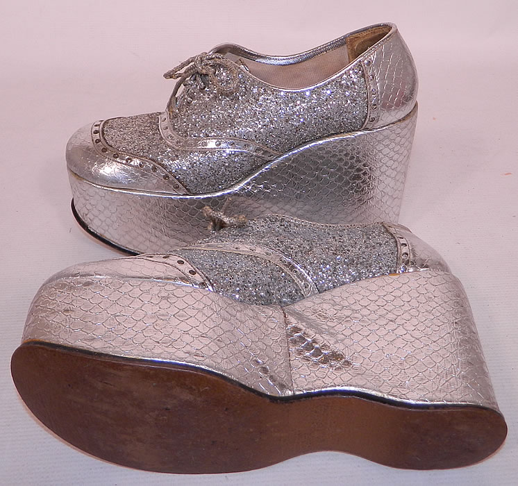 Vintage Di Orsini Silver Glitter Snakeskin Disco Platform Shoes. They should fit a size 8 or 9 foot.  They are in good condition and have been gently worn. This is truly a wonderful piece of wearable retro shoe art! 