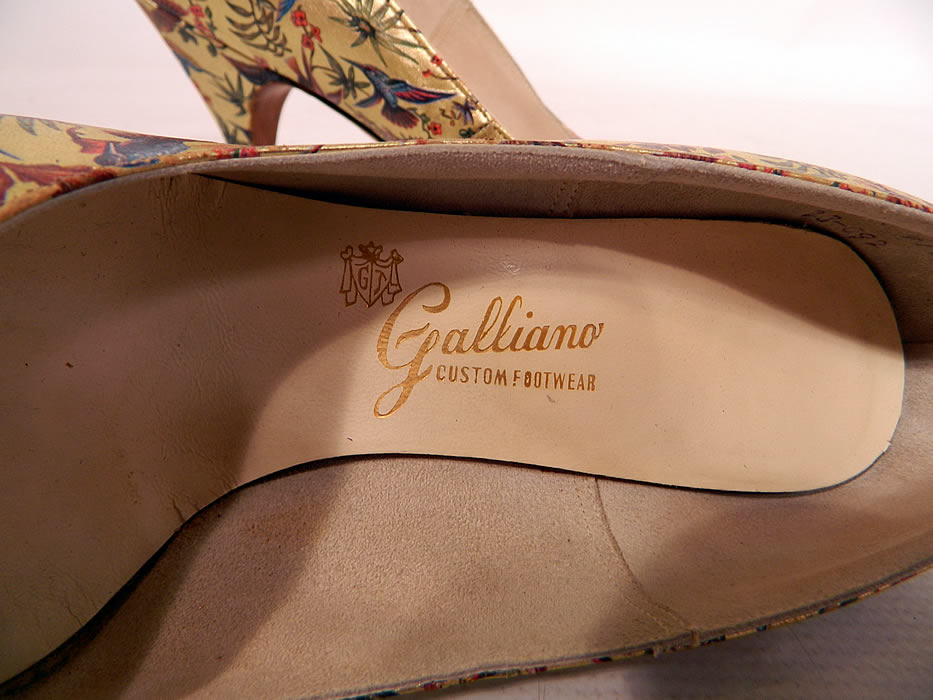 Vintage Galliano Gold Leather Botanical Hummingbird Print Stiletto Heel Shoes. There is a "Galliano Custom Footwear" and "C.H. Baker California" labels gold embossed on the insoles inside. 