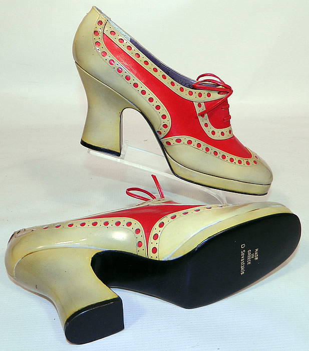 Unworn Vintage Jerry Edouard Joseph Red Eyelet Leather Oxford Platform Shoes & Box. The shoes measure 10 inches long, 2 1/2 inches wide, with 3 inch high heels. I would guess the appoximate size to be a 7 narrow width. They are in good unworn condition and have never been worn, with only some minor yellowing discoloration on the leather from storage and come in the original shoe box. These are truly a rare and wonderful piece of wearable shoe art!