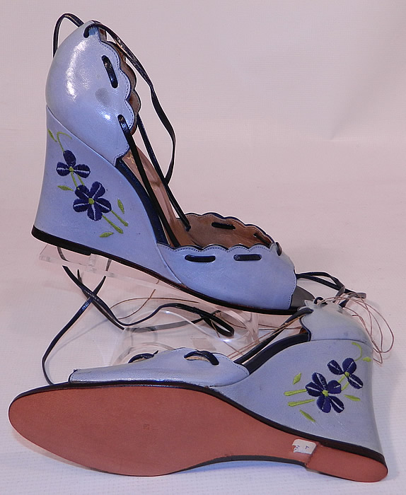 Vintage Shoes by Ivory Blue Leather Floral Embroidery Ankle Strap Wedge Heel. The shoes measure 10 inches long, 3 inches wide, with 3 1/2 inch high heels and are approximately a size 8. 