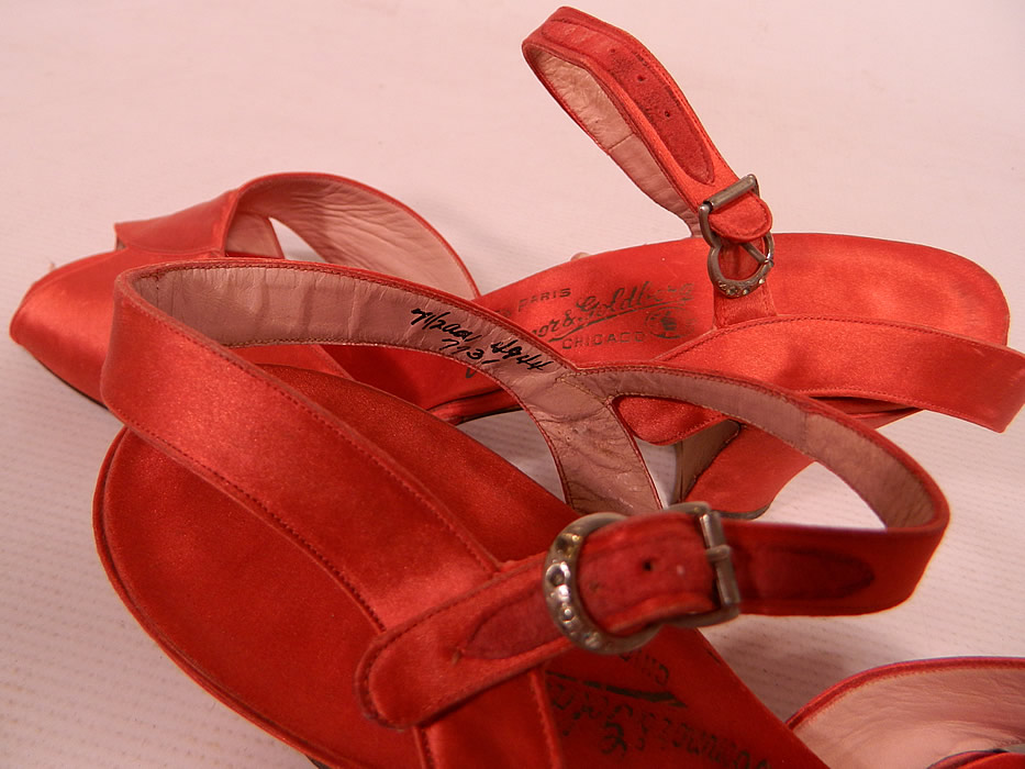 Vintage O'Connor & Goldberg Red Silk Satin Ankle Strap Evening Shoes
The shoes measure 10 inches long, 2 1/2 inches wide, with 2 1/2 inch high heels and are stamped inside a size 7 1/2 AA.
