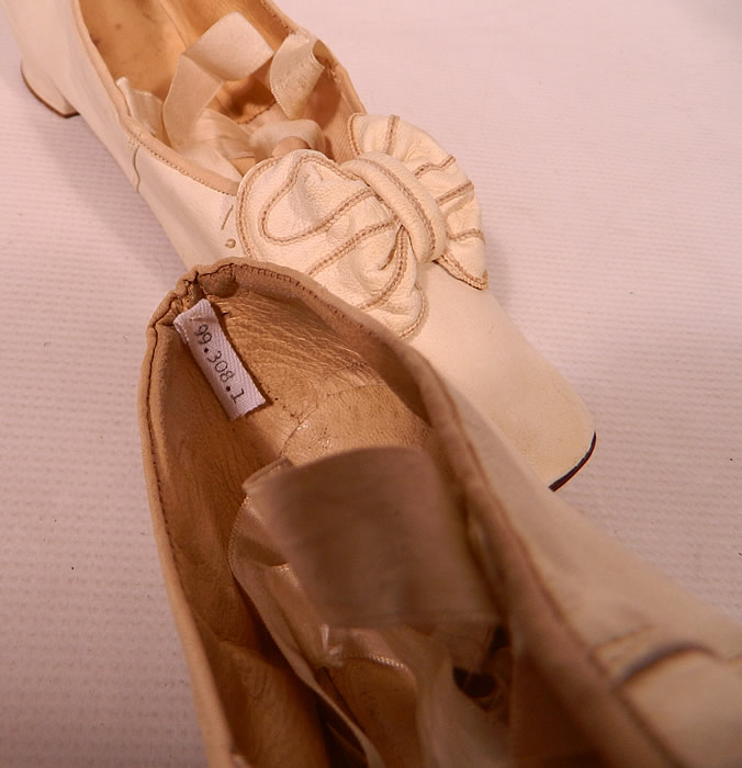 Victorian Wedding White Kid Leather Bow Trim Ribbon Ties Straight Sole Shoes
There is a numbered tag sewn inside and are a museum deaccession. These delicate wedding slippers were probably reserved for indoor wear, evening dress or special occasions. They are truly a rare and wonderful piece of early bridal wedding shoe art!
