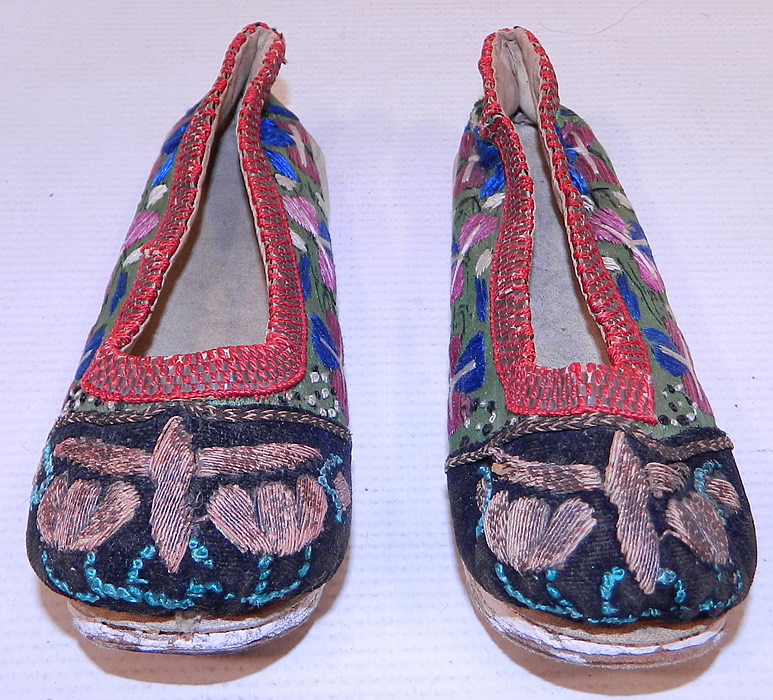 Antique Chinese Forbidden Stitch Embroidered Bound Foot Slippers Platform Shoes
These small slipper style platform shoes have a cloth layered wedge quilted stitched hard leather bottom sole with painted white lifts.