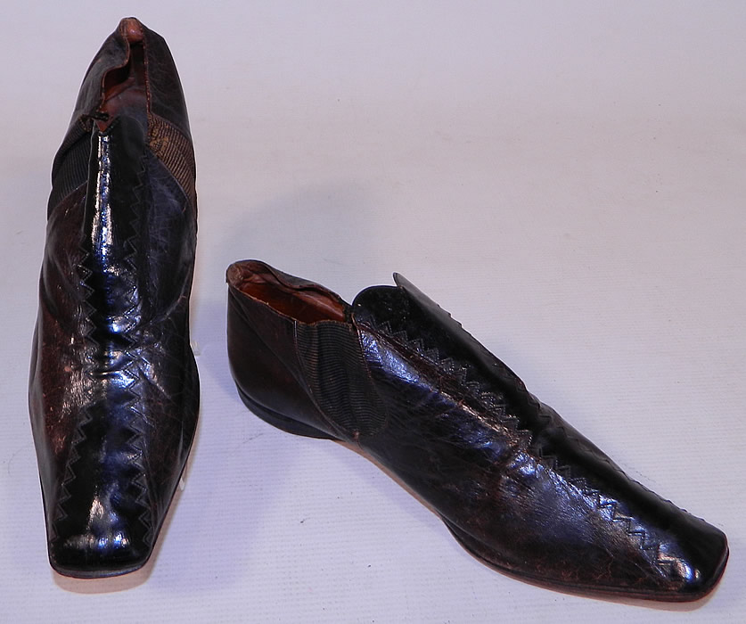 Victorian Brown & Black Leather Crooked Sole Square Toe Dainty Ankle Half Boots
These early dainty half boot shoes have a slightly crooked hard leather bottom sole, squared toes, a low slight heel and ribbed textured fabric gusset insert sides.