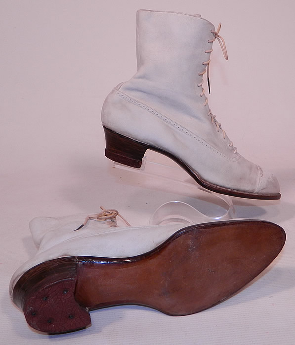 Vintage Nihleen NY Label Victorian White Suede Leather High Top Lace-up Boots
These antique boots are difficult to size for today's foot, but my guess would be about a US size 7 narrow width. They are old store stock, in good unworn condition, with only some slight soiling scuff marks on the toes and heels from display & storage. These are truly a rare and beautiful quality made antique boot!