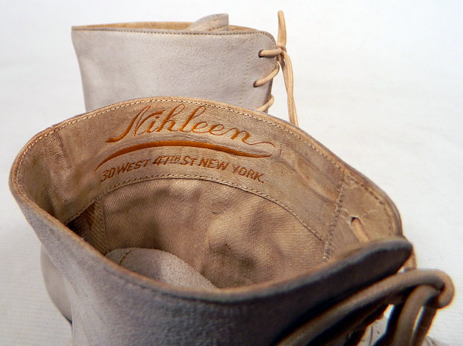 Vintage Nihleen NY Label Victorian White Suede Leather High Top Lace-up Boots
The boots have pointed toes, the original white shoe string laces for closure and stacked wooden cube heels. They are fully lined and have a "Nihleen 30 West 47th Street New York" label inside.