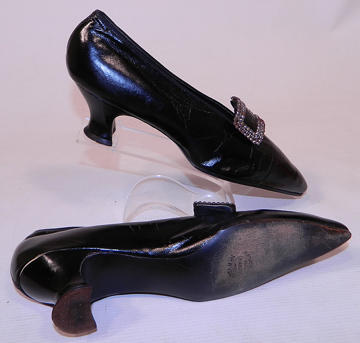 Edwardian Hanan & Son NY Black Patent Leather Steel Cut Buckle Shoes & Shoe Bag
These elegant evening shoes have a slip on slipper style, with exaggerated pointed toes and leather covered Louis XV French heels.
