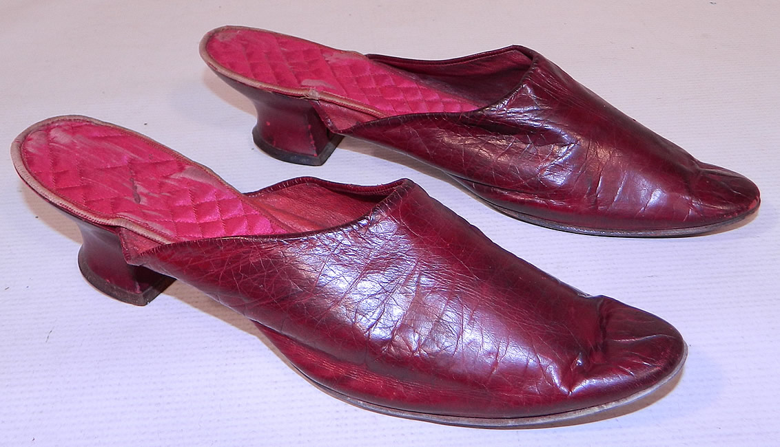 Victorian Womens Red Leather Quilted Silk Lining Backless Mules Slipper Shoes
These radiant red ladies backless mules slip-on slipper style shoes have pointed toes and red leather covered low French Louis XV heels. The shoes measure 8 1/2 inches long and 2 1/2 inches wide.