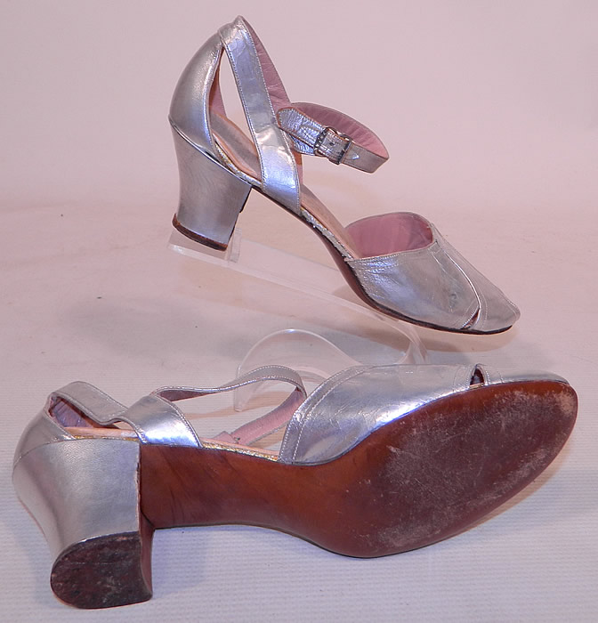 Vintage Sam's Slipper Shoppe Silver Metallic Leather Art Deco Ankle Strap Shoes
My guess on a modern size would be about a size 6 or 7 narrow width for today's foot. The shoes are in good condition and have been gently worn, with some minor wear along the leather. These are truly a wonderful piece of wearable Art Deco shoe art!