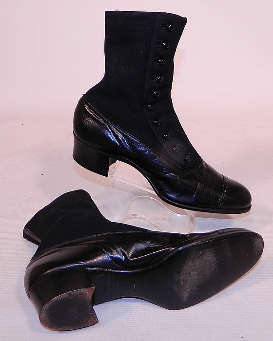 Victorian Black Wool & Leather High Top Button Boots T.E. Moseley Co. Boston
These beautiful boots have rounded toes with decorative punch work design, 10 black shoe buttons along the side for closure and stacked black wooden cube heels.