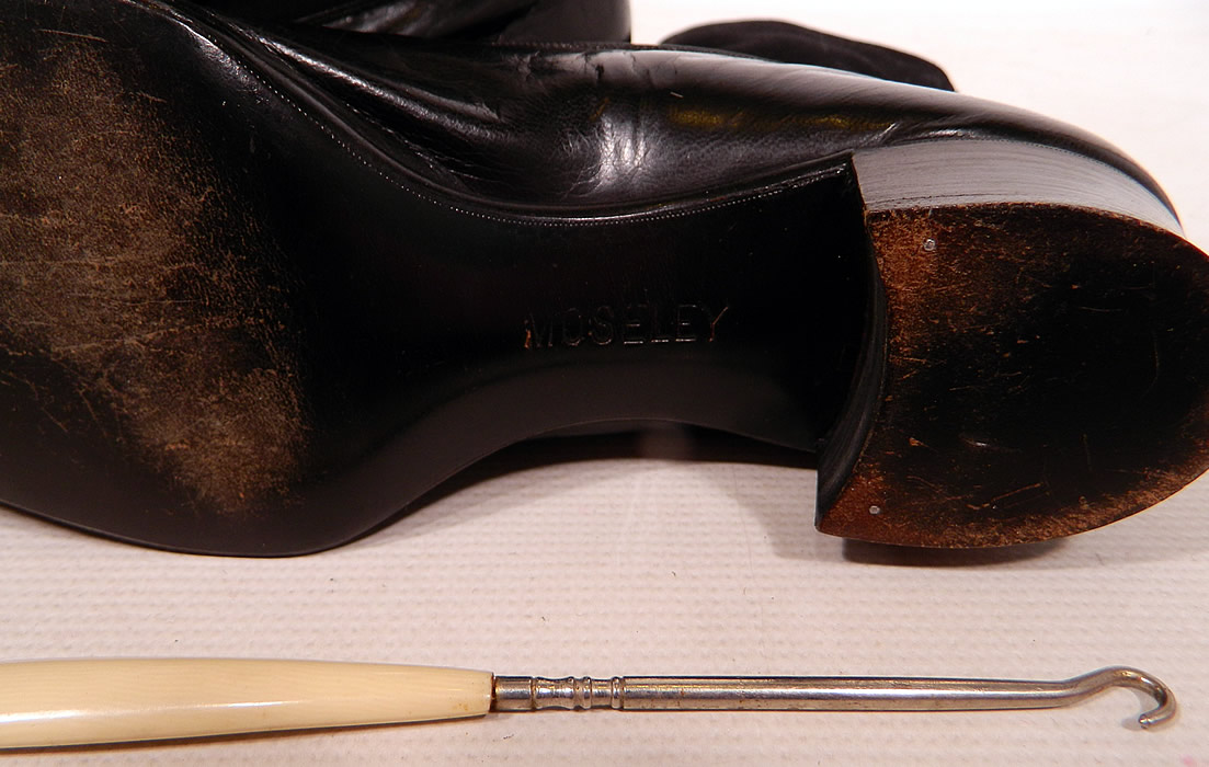Victorian Black Wool & Leather High Top Button Boots T.E. Moseley Co. Boston
These antique boots are difficult to size for today's foot, but my guess would be about a US size 7 or 8 narrow width. They are in excellent wearable condition, gently worn and come with a celluloid handle button hook. These are truly a rare and beautiful quality made antique boot!