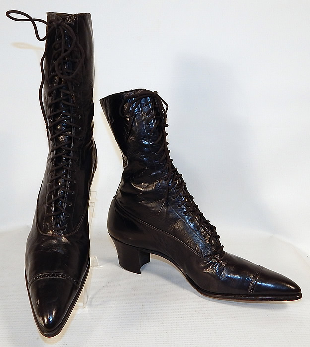 Unworn Victorian Black Leather High Top Lace-up Boots Poehlman Shoe Co.
The boots have pointed toes, the original black shoe string laces for closure and stacked black wooden cube heels.