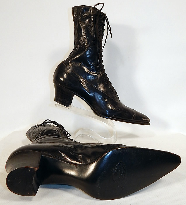 Unworn Victorian Black Leather High Top Lace-up Boots Poehlman Shoe Co.
The boots measure 9 1/2 inches tall, 11 inches long, 2 1/2 inches wide, with 2 inch high heels. These antique boots are difficult to size for today's foot and would be approximately a US size 7 or 8 narrow width. 